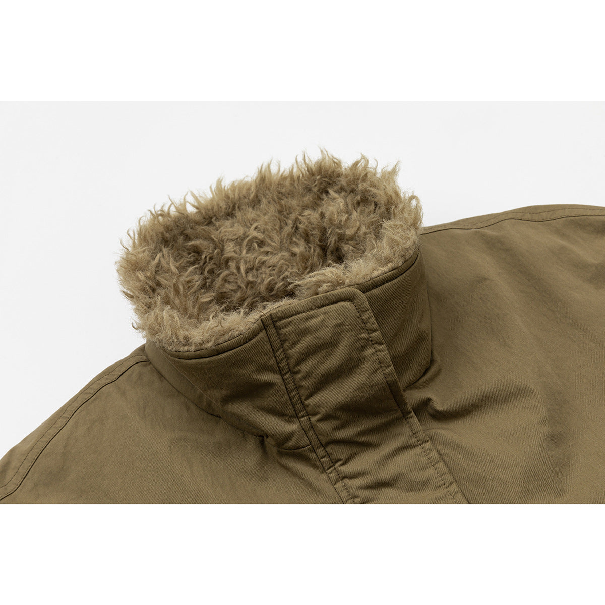 Close-up of an olive-brown coat collar with thick, curly tan lining and a stitched front placket.