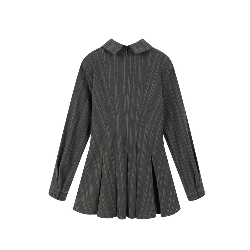 Back view of dark gray pinstriped peplum top with collar, neck zipper, buttoned cuffs and pleated flared hem