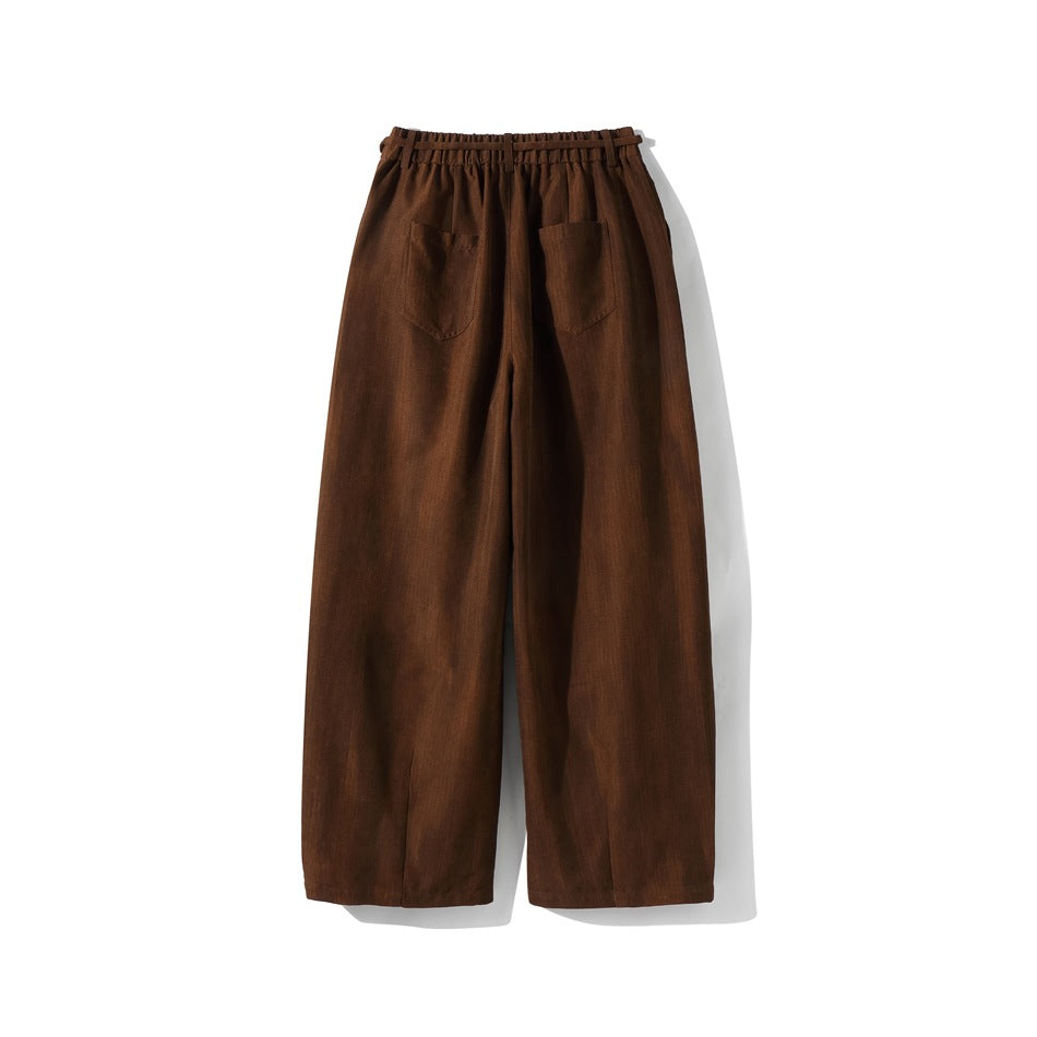 Brown wide-leg pants flat lay, back view, with elastic waistband and two patch pockets