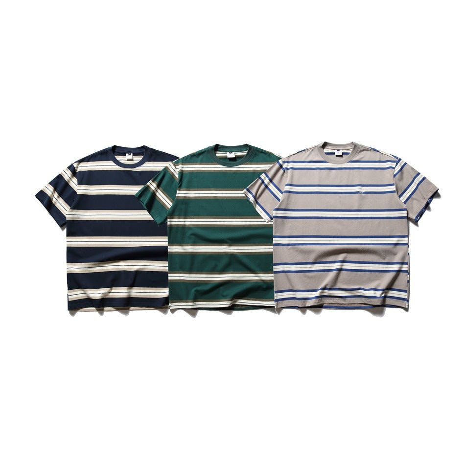 Three short-sleeve striped crew-neck T-shirts shown from the front in navy, dark green, and taupe.