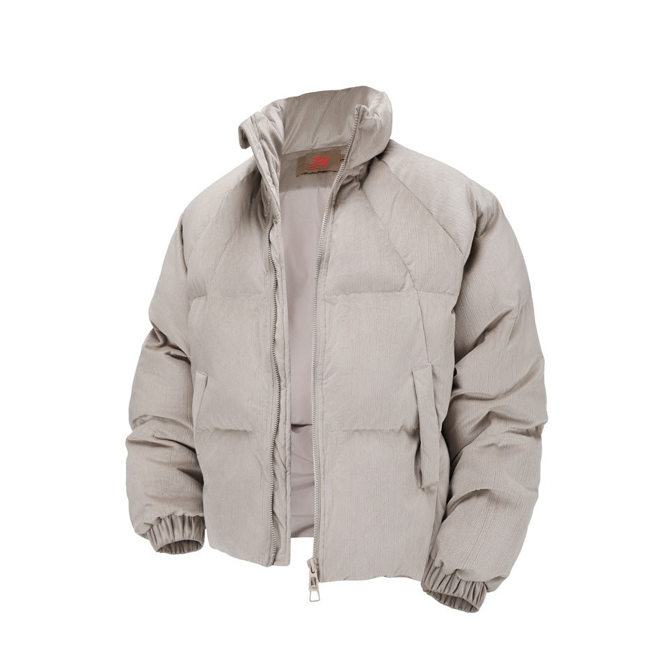Gray taupe puffer jacket with zip partly open, showing stand collar, inner lining, pockets and elastic cuffs
