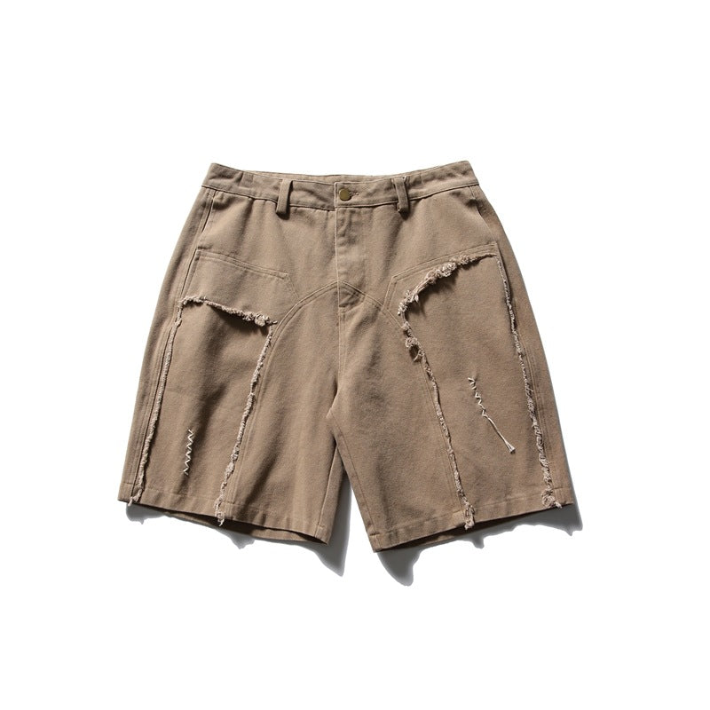 Khaki knee-length shorts with frayed curved panel seams, white zigzag stitching and a raw hem, flat front view