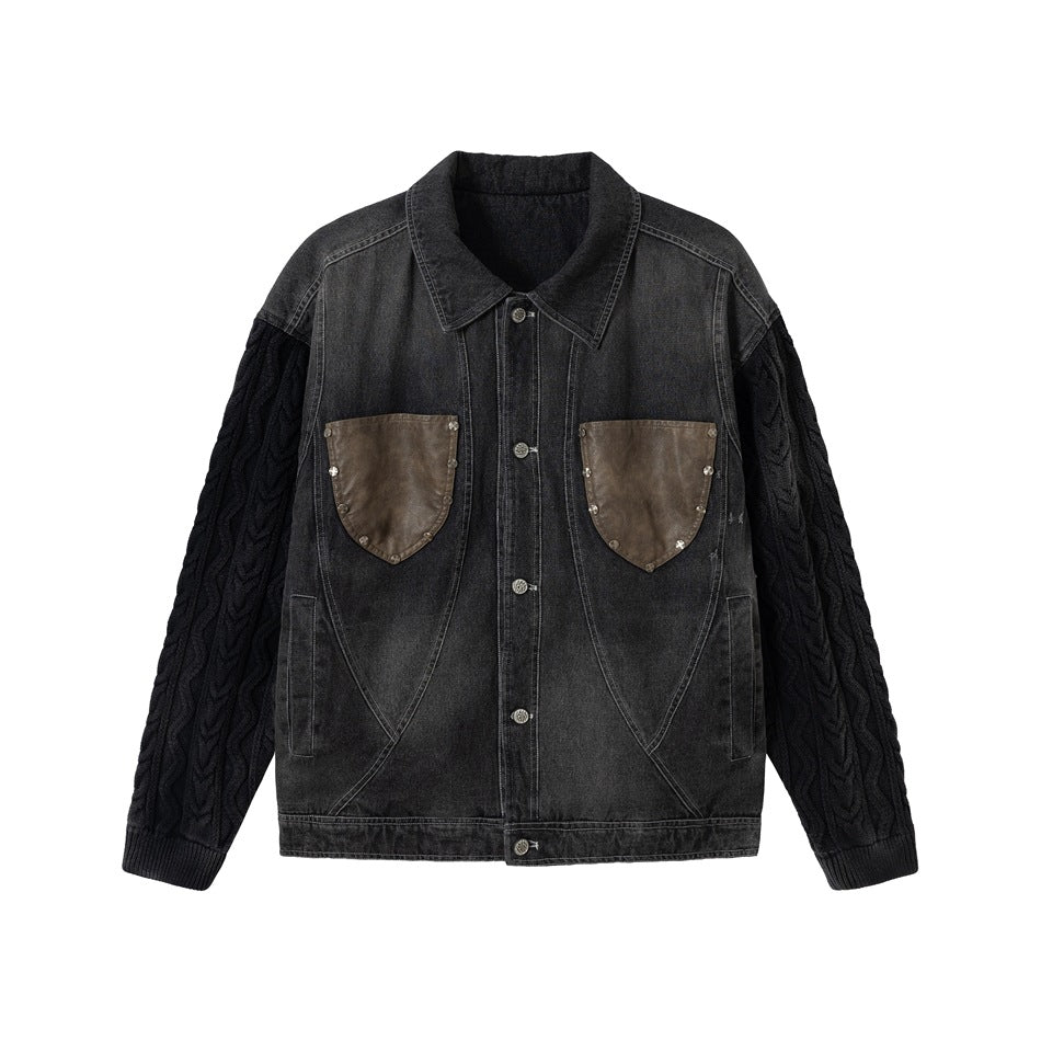 Black washed denim jacket with cable-knit sleeves and brown shield-shaped chest pockets on a white background