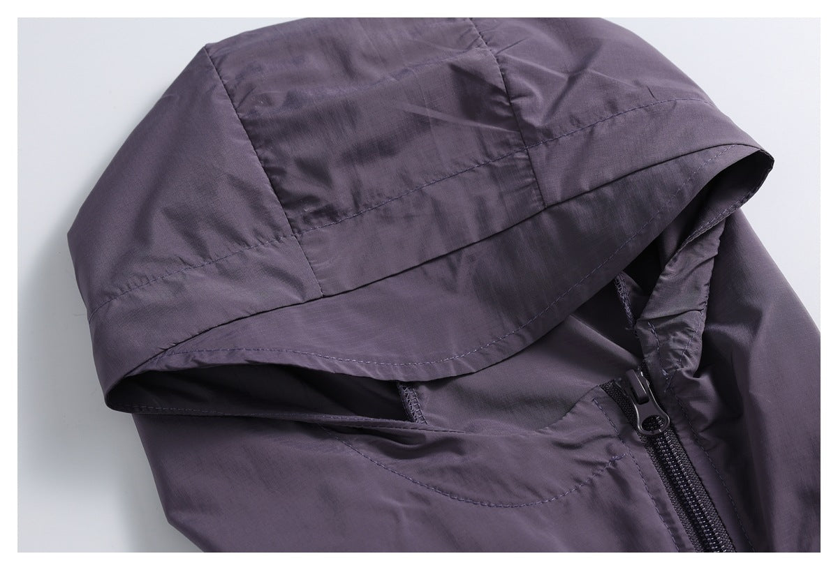 Close-up of a dark purple jacket hood and front zipper, highlighting the hood seams and construction.