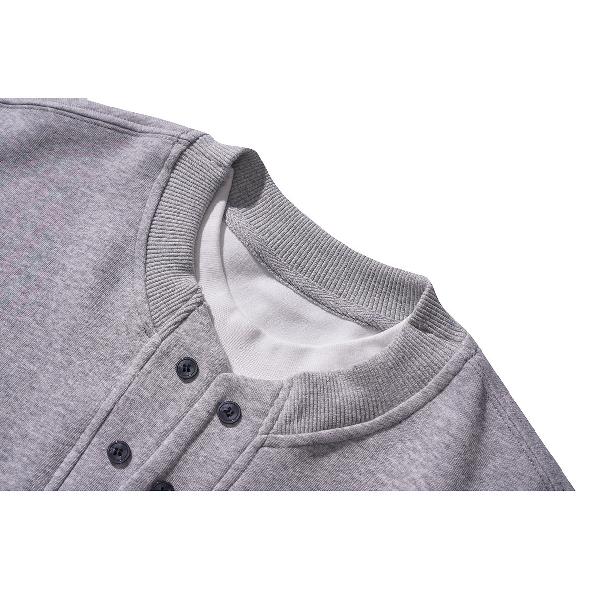 Close-up of a gray sweatshirt's ribbed crew neckline and dark-button placket.