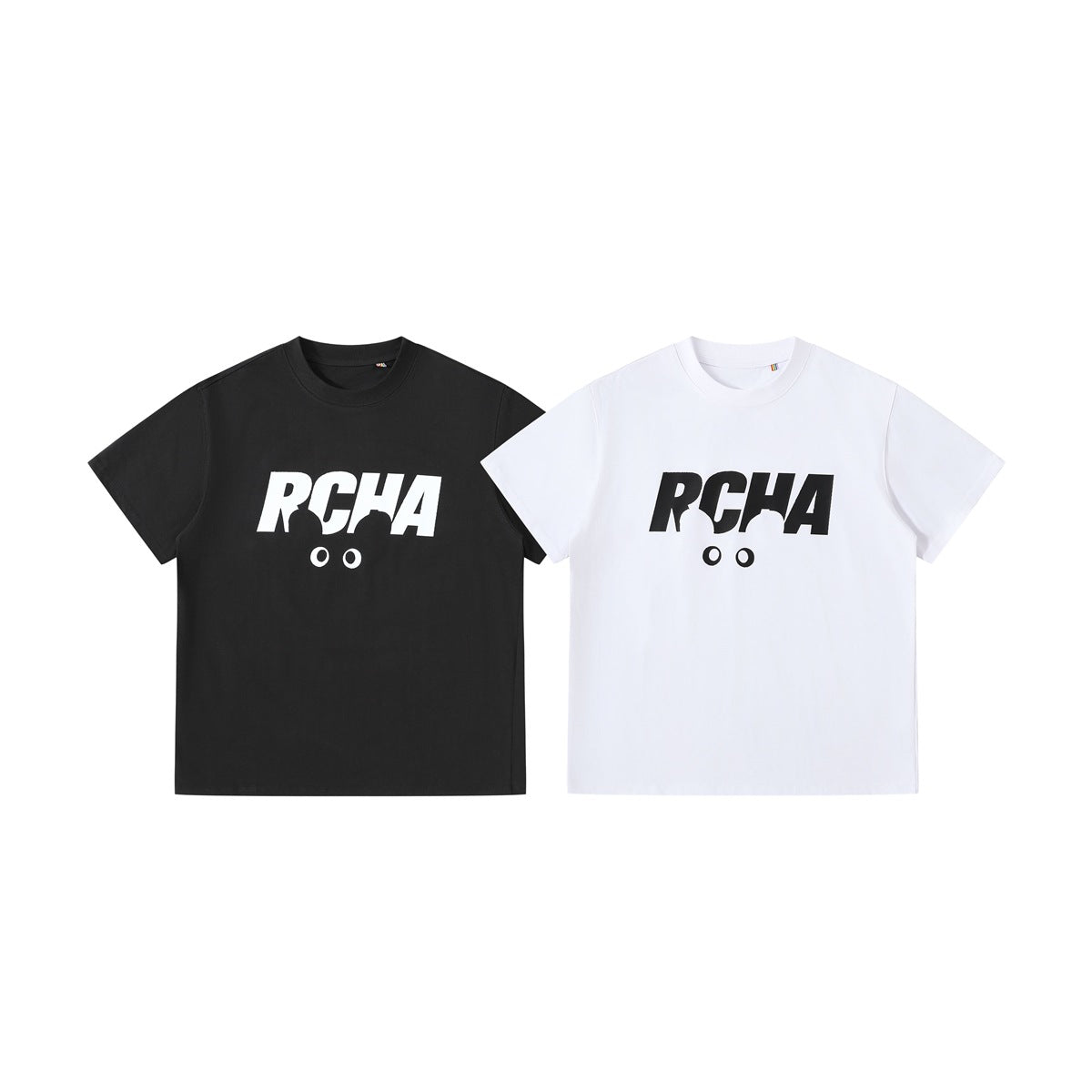 Front views of black and white short-sleeve crew-neck T-shirts, each with a contrasting stylized chest graphic.