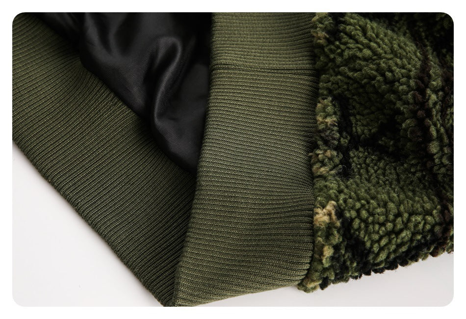 Close-up showing a dark olive rib-knit edge, black lining, and mottled green fleece.
