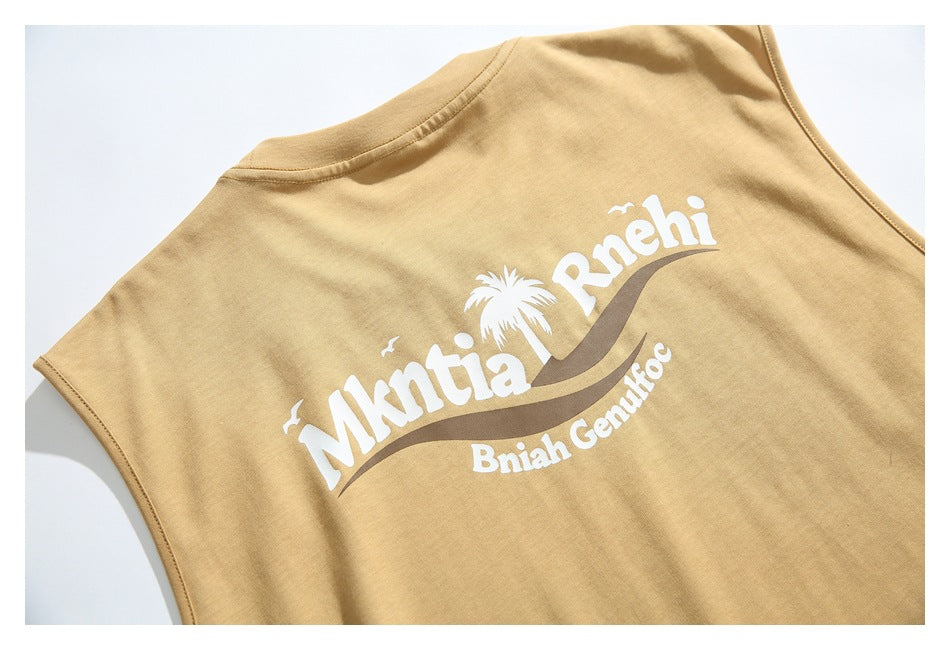 Close-up of a white and brown tropical-style graphic printed on the back of a tan T-shirt.
