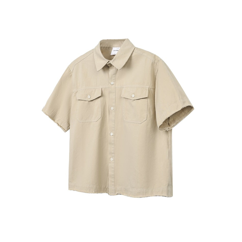 Light khaki short-sleeve work shirt with two button flap chest pockets and raw frayed hem, flat view