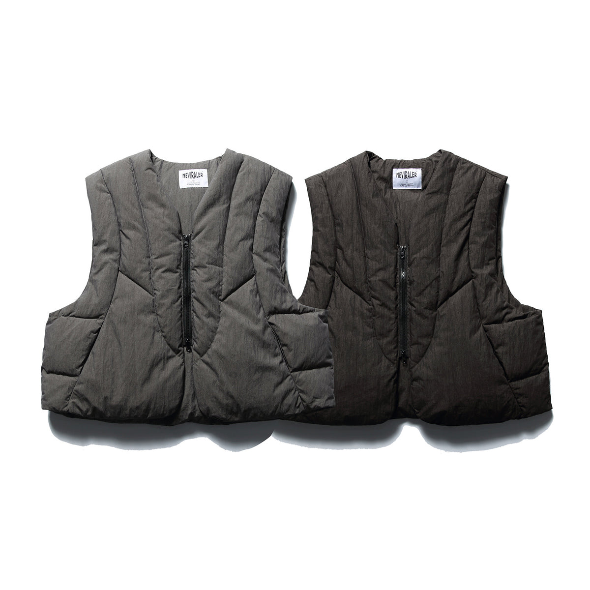 Two sleeveless padded vests shown from the front, one gray and one dark charcoal, with black zippers.