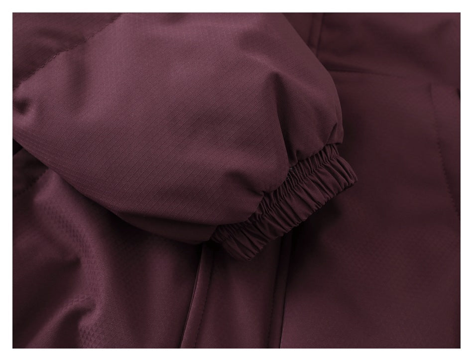 Close-up of the burgundy jacket sleeve and gathered elastic cuff.