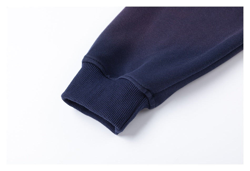 Close-up of a navy sleeve ending in a wide ribbed cuff.