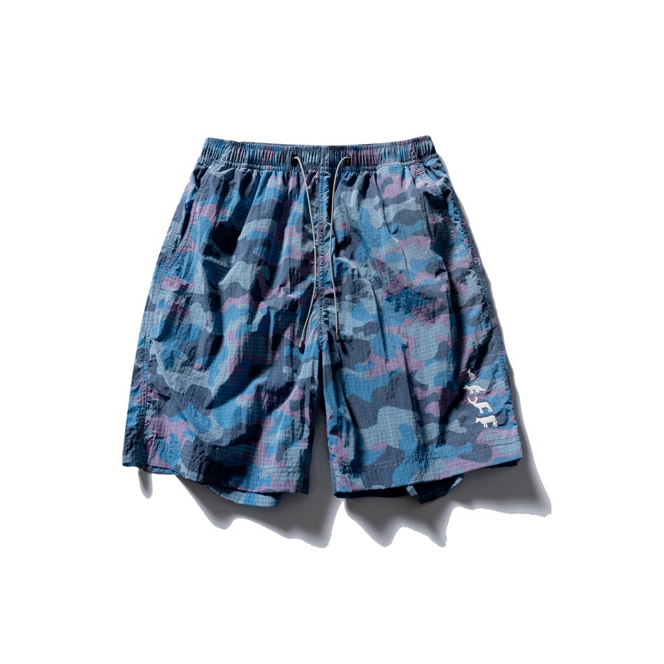 Blue and purple camouflage shorts with drawstring elastic waist and small white animal motif, flat front view