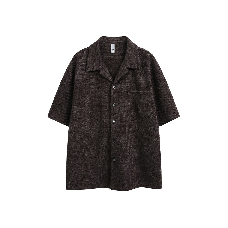 Dark brown textured short-sleeve button-up shirt with camp collar and chest pocket, flat front view