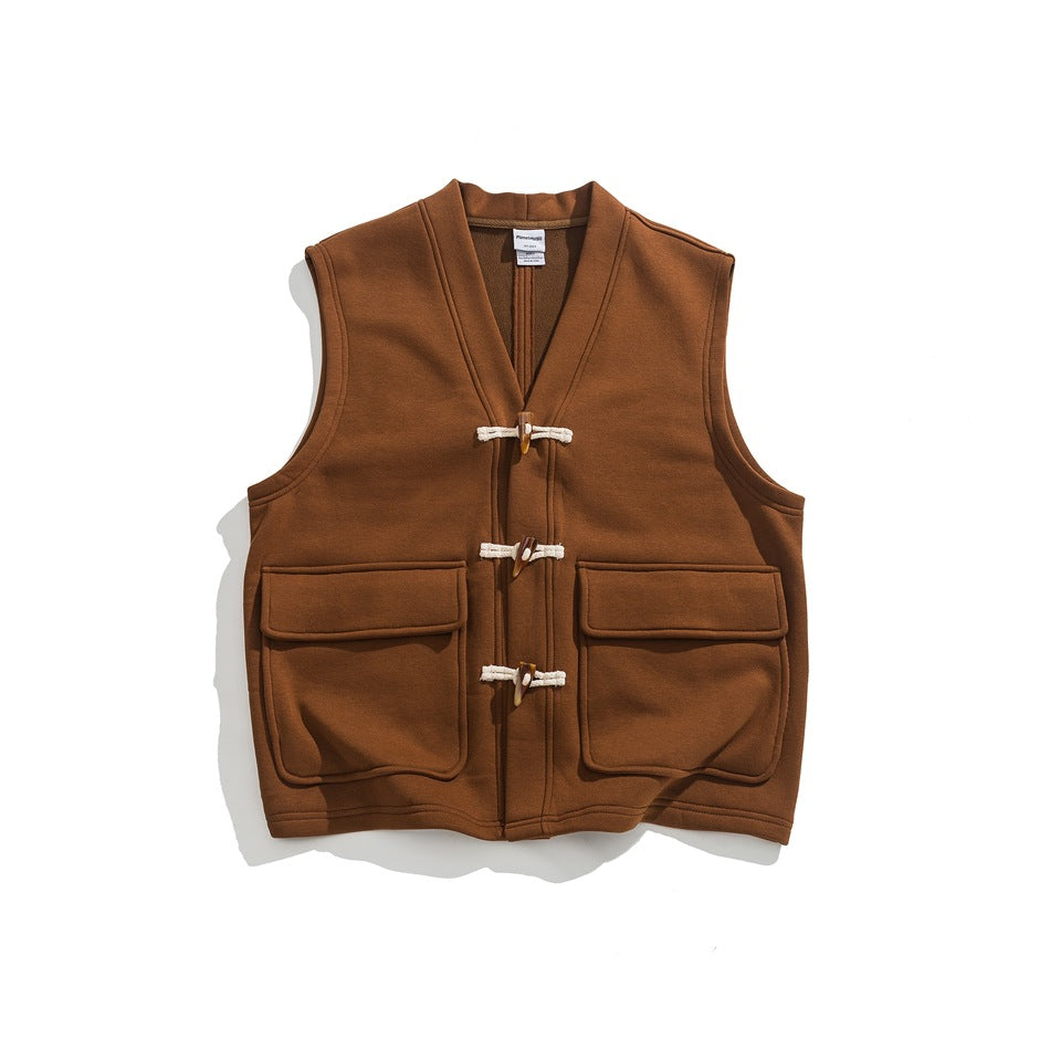 Caramel brown sleeveless V-neck vest with toggle closures and two large flap pockets, flat lay