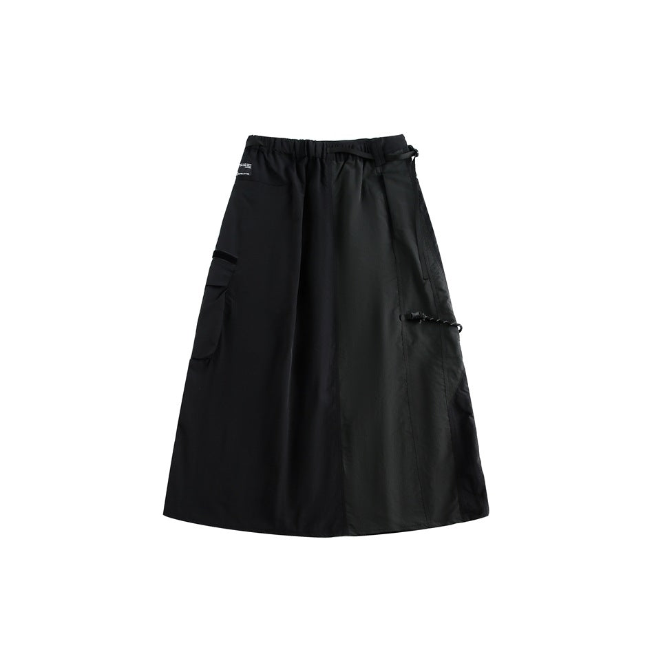 Black wide-leg wrap-style skirt shown flat against a white background, with an elastic waist, pockets and side straps.