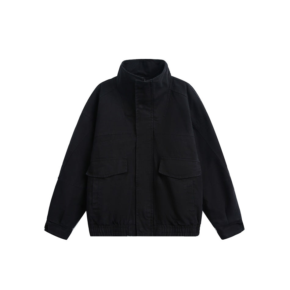 Black stand-collar jacket, flat front view with two flap chest pockets and an elastic hem