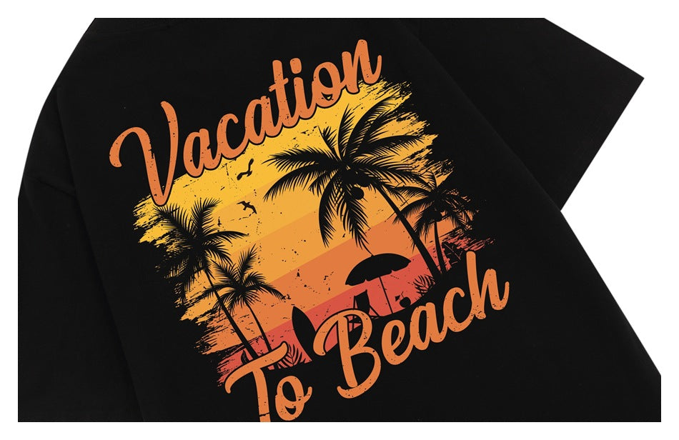 Close-up of black fabric with orange “Vacation To Beach” lettering and a sunset, palm tree, and beach graphic.