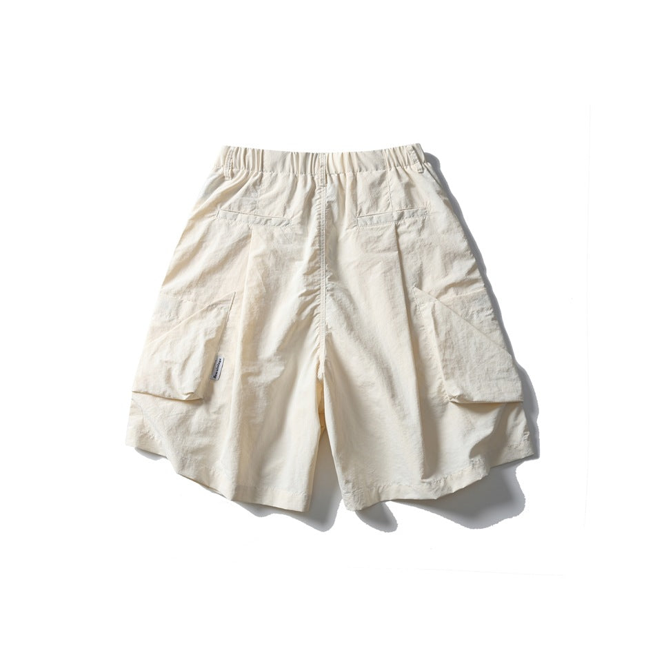 Off-white cargo shorts shown from the back, with an elastic waistband, two rear welt pockets and large side cargo pockets.