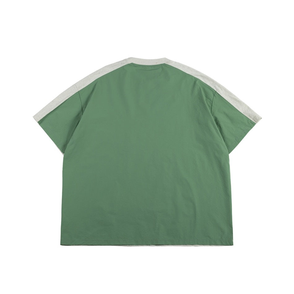 Back view of a sage green short-sleeve T-shirt with light gray shoulder and sleeve panels.