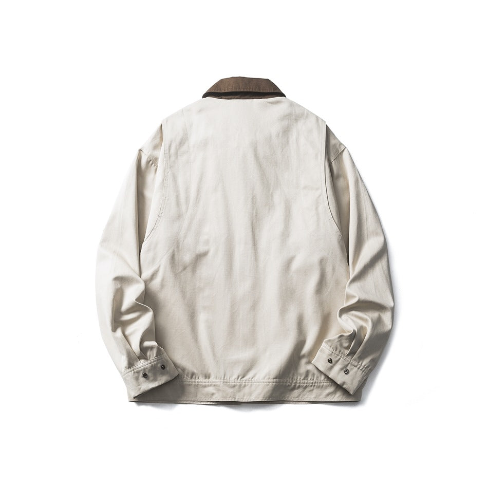 Back view of an ivory jacket with a dark brown collar and buttoned cuffs.