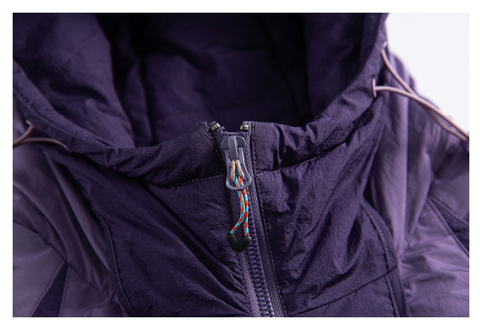 Close-up of a purple jacket's zipper with a multicolor cord pull and hood drawcords.