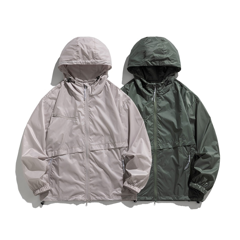 Two hooded jackets shown from the front in light taupe and dark olive, with zip fronts and multiple pockets.