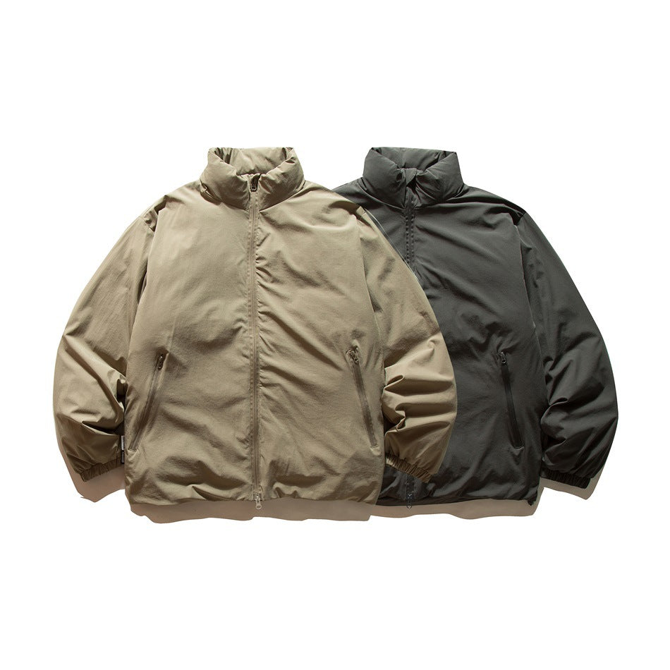 Two front-facing zip jackets with stand collars, in tan and charcoal.