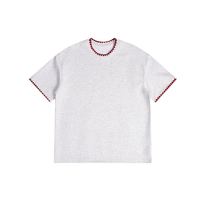 Light heather gray short-sleeve crew-neck tee with red scalloped embroidered trim at the neckline and sleeve hems, front view