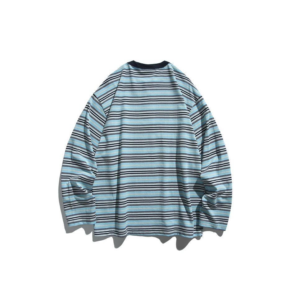 Flat-lay back view of a blue long-sleeve shirt with black, white, and tan horizontal stripes.