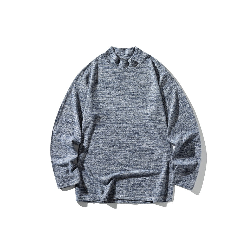 Blue marled mock neck long-sleeve top laid flat on a white background