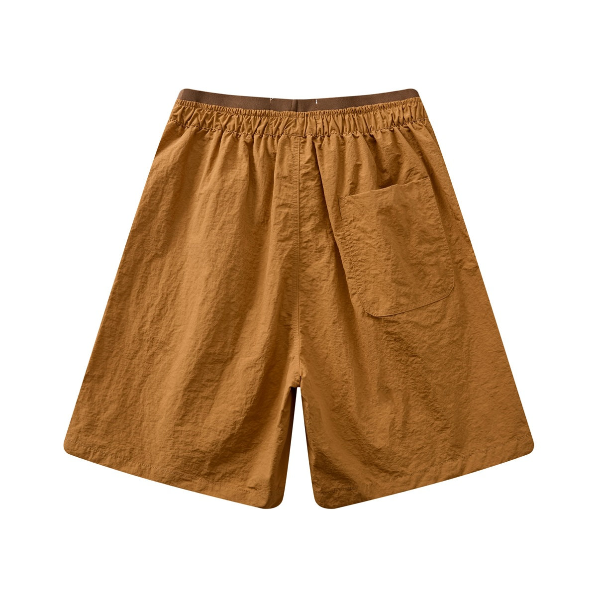 Back view of ochre shorts with an elastic waistband and a large patch pocket.