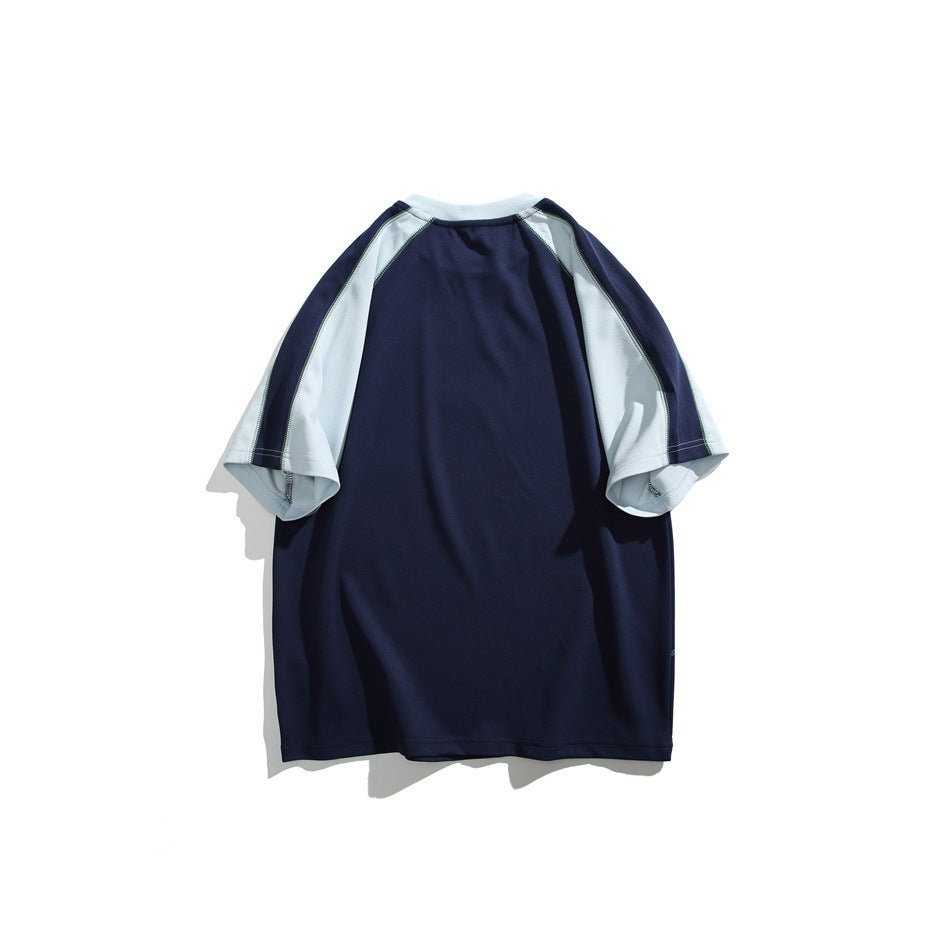 Back view of a navy short-sleeve raglan tee with pale gray sleeve panels, shown flat against white.