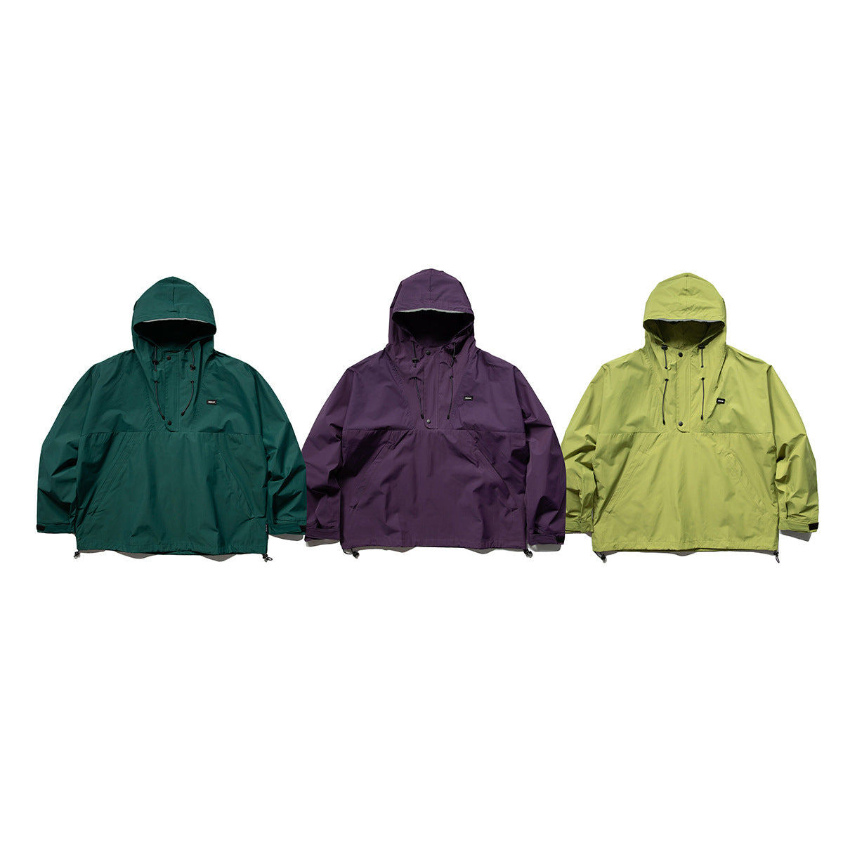 Three hooded pullover jackets shown from the front in dark teal, purple and lime green.
