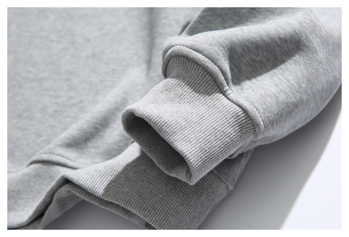 Close-up of the heather-gray sweatshirt sleeve and ribbed cuff.