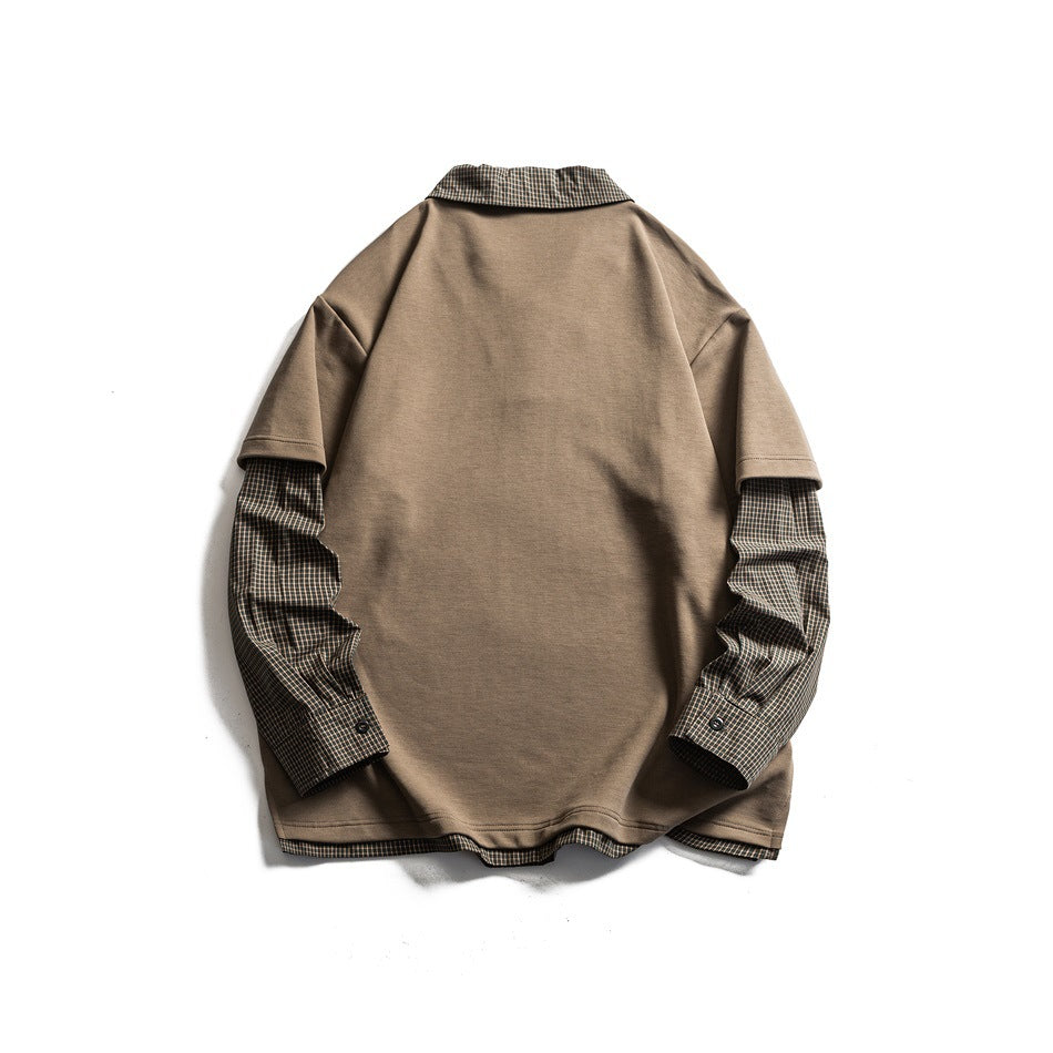 Back view of a taupe short-sleeve top layered over brown plaid sleeves, collar, and hem.