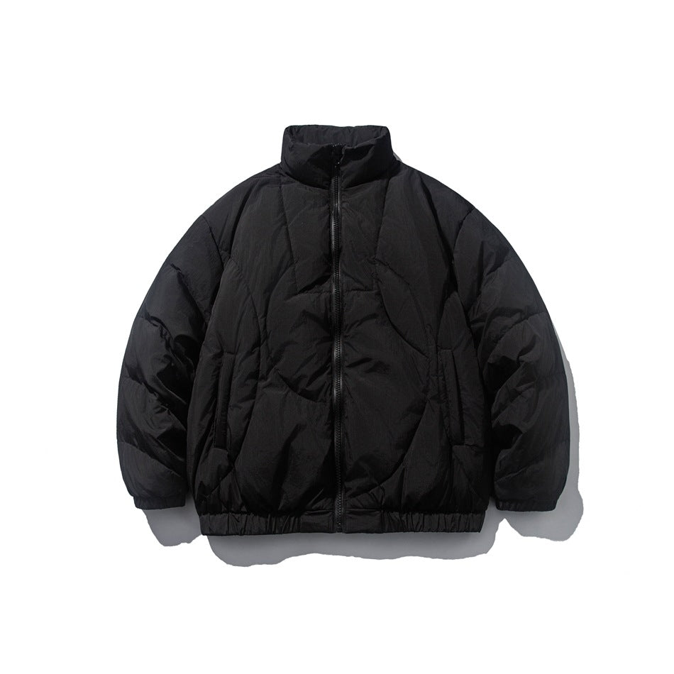 Black quilted puffer jacket with stand collar, front zipper, side pockets and elastic hem, flat lay front view