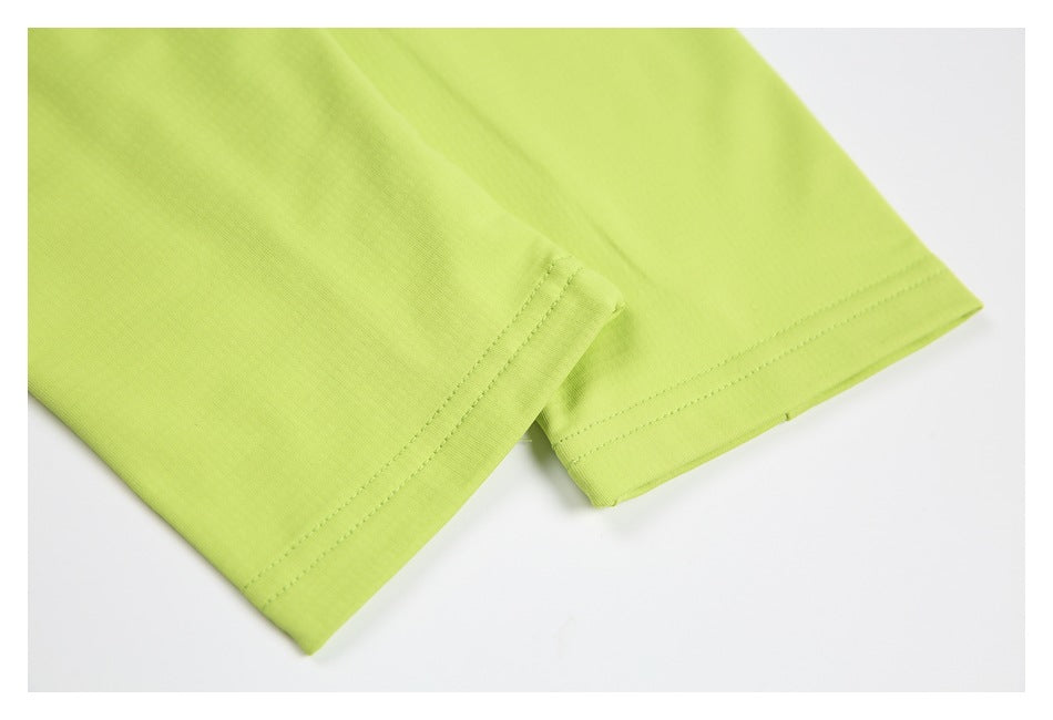Close-up of lime-green garment edges with double-stitched hems.