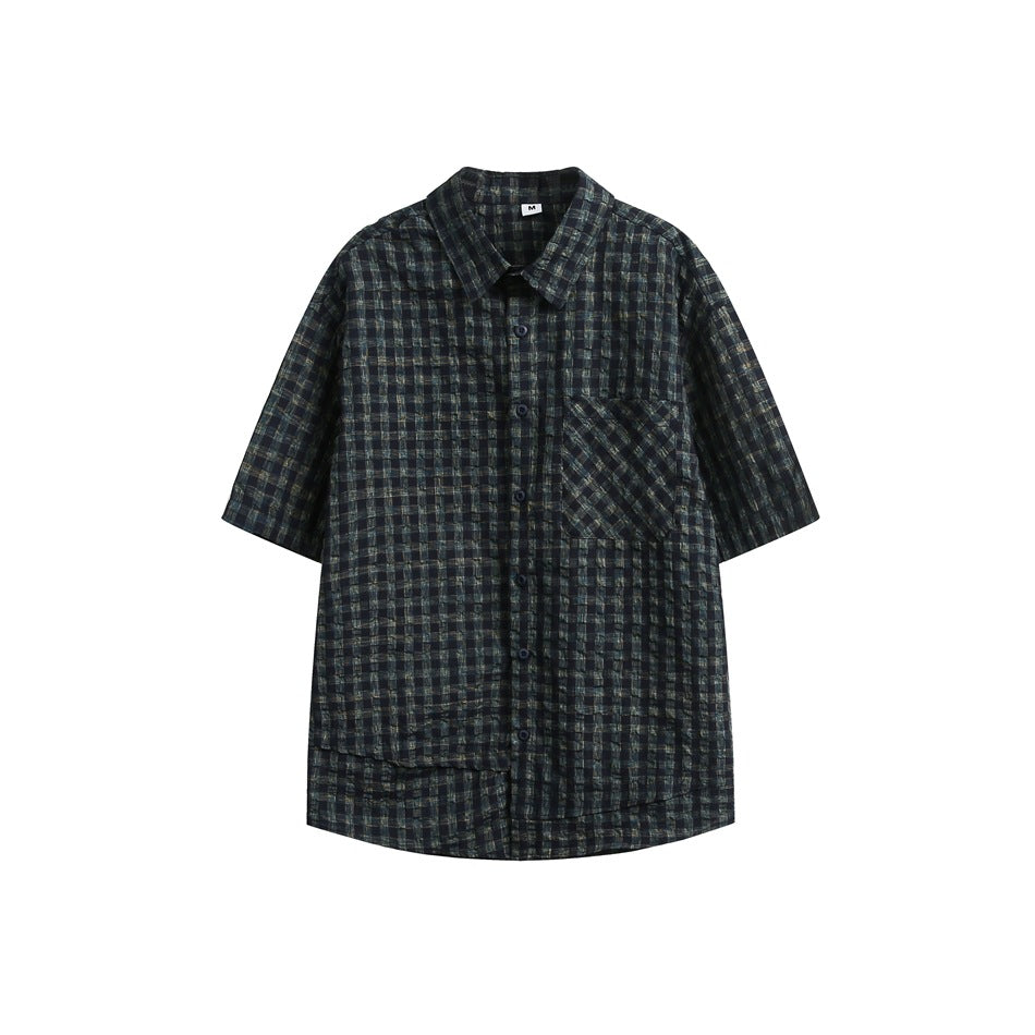 Dark navy and black check short-sleeve button-up shirt with chest pocket and layered hem, flat lay on white