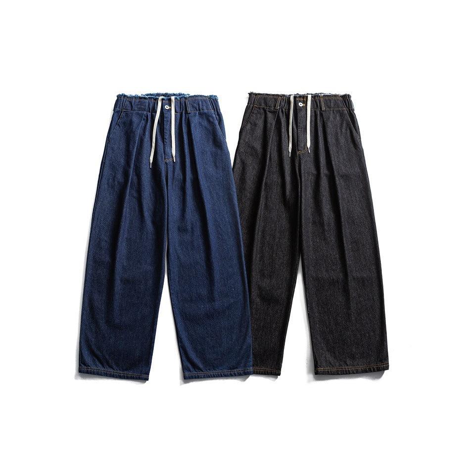 Front view of wide-leg drawstring jeans in indigo blue and charcoal, shown side by side.