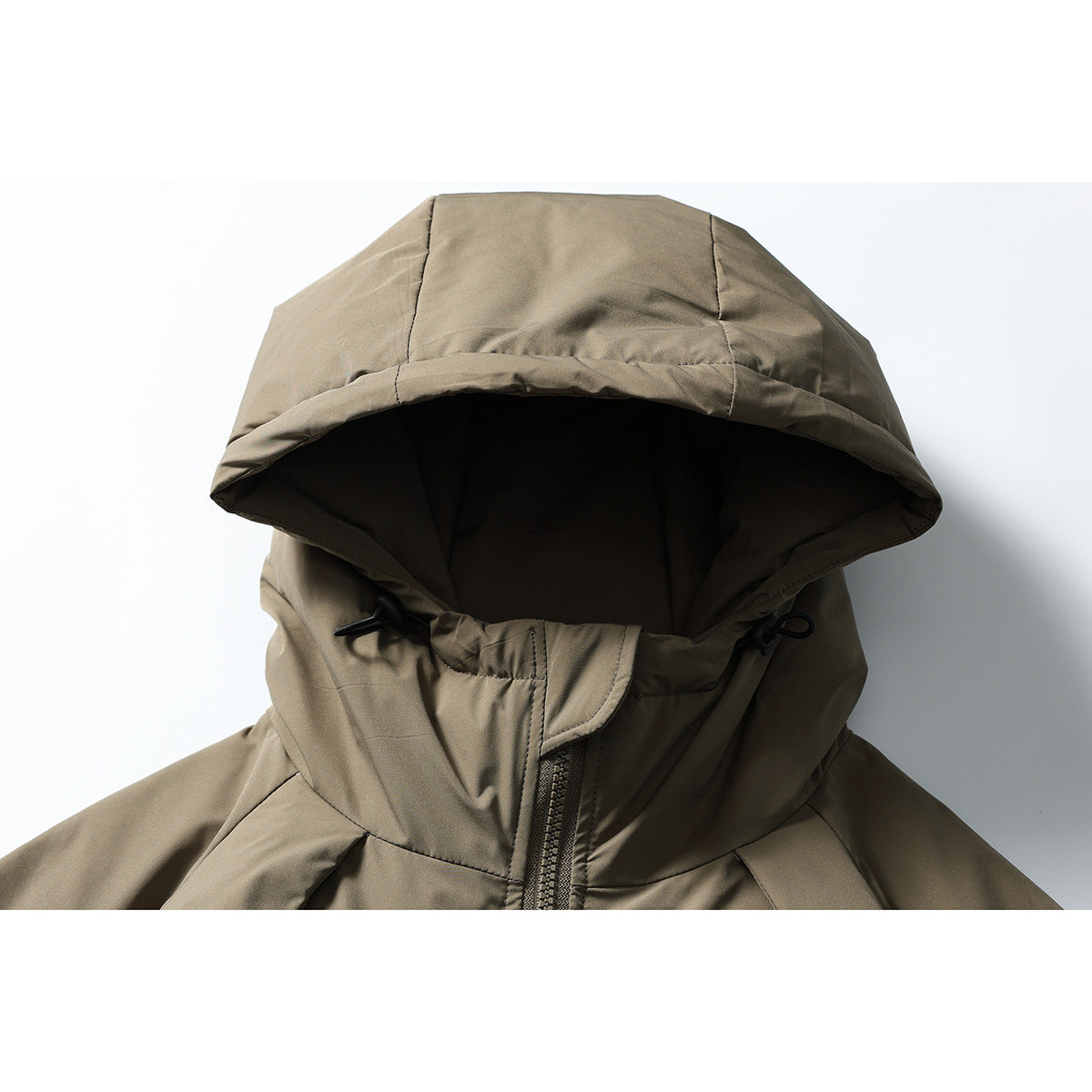 Close-up of an olive-brown hooded jacket showing the hood, high collar, drawcords, and front zipper.