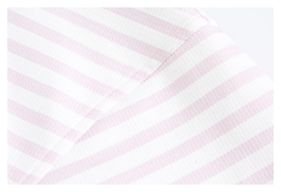 Close-up showing the pale pink and white striped fabric and a stitched seam.