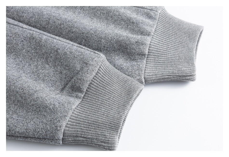 Close-up of the gray coat's sleeves and ribbed cuffs.