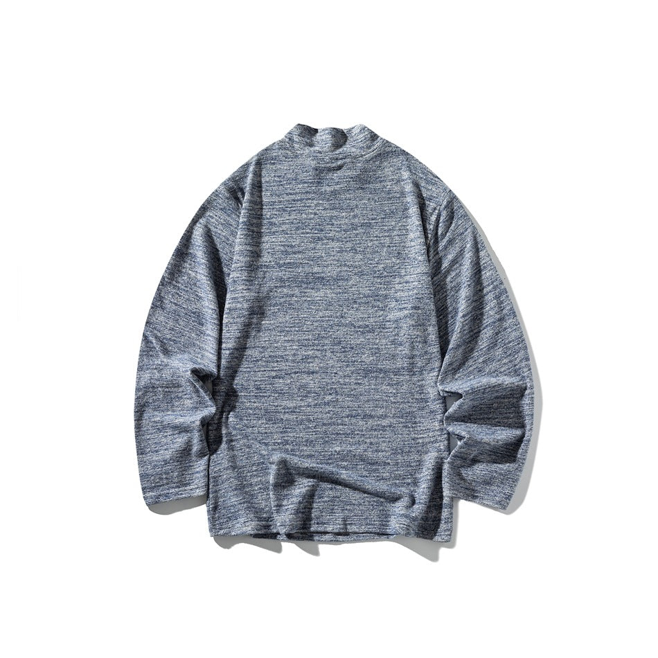 Blue and gray heathered long-sleeve mock-neck top shown laid flat against a white background.