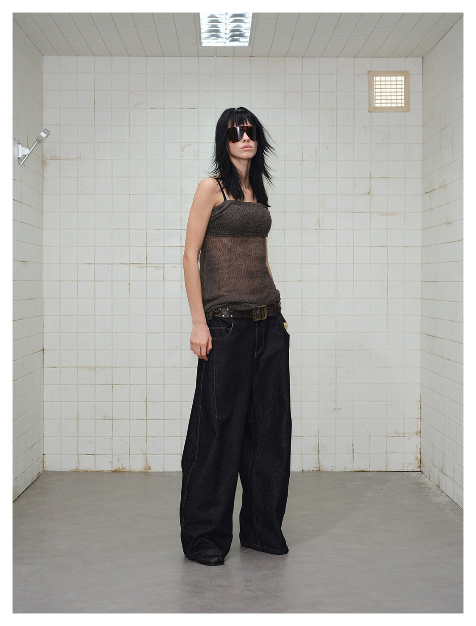 Model wearing dark wide-leg jeans with contrast stitching, shown from the front with a brown sleeveless top.