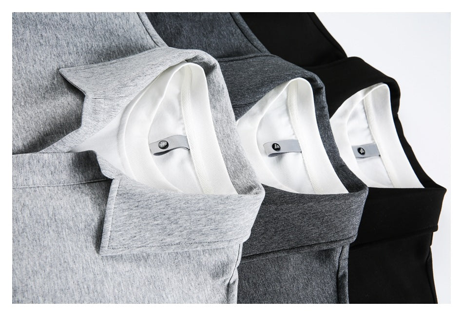 Close-up of three polo shirt collars in light gray, charcoal gray, and black, arranged side by side.