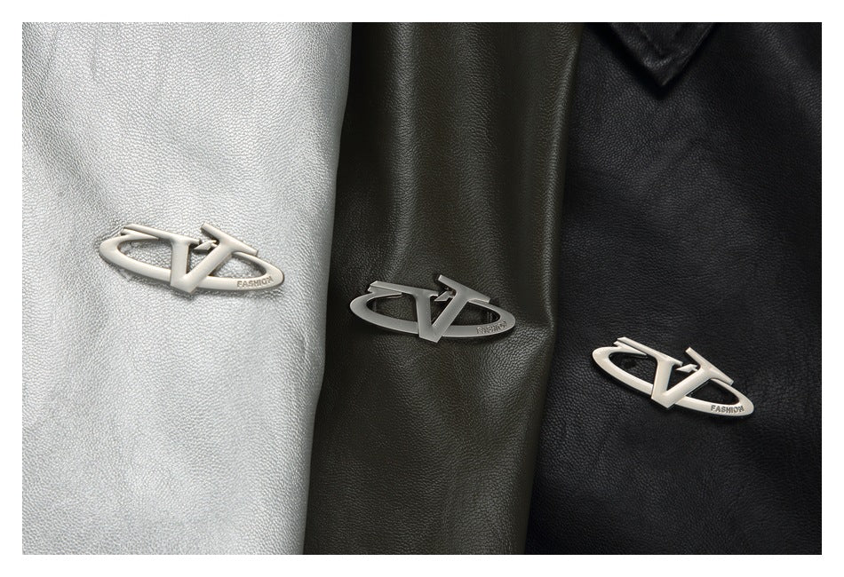 Silver, olive, and black garment panels shown together, each with a small metal logo plaque.