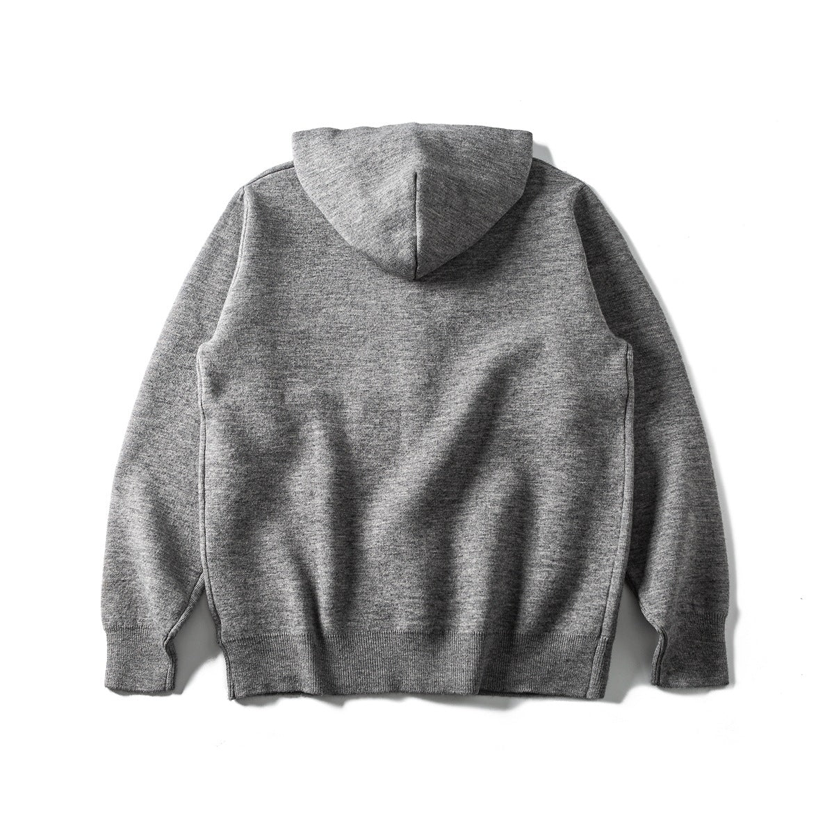 Back view of a heather gray hooded knit cardigan laid flat, with long sleeves and ribbed cuffs and hem.