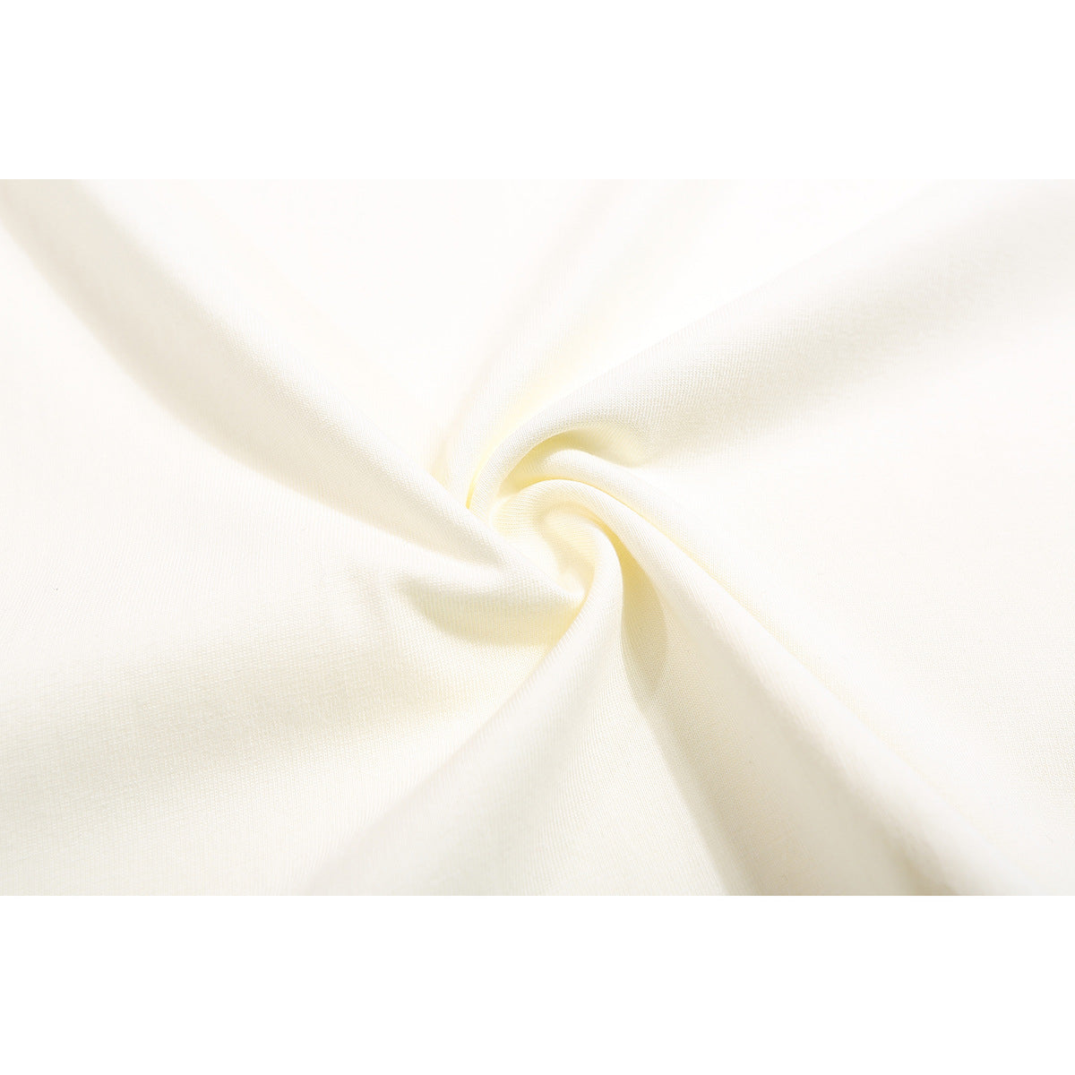 Close-up of off-white fabric gathered into a twist, showing its surface texture.