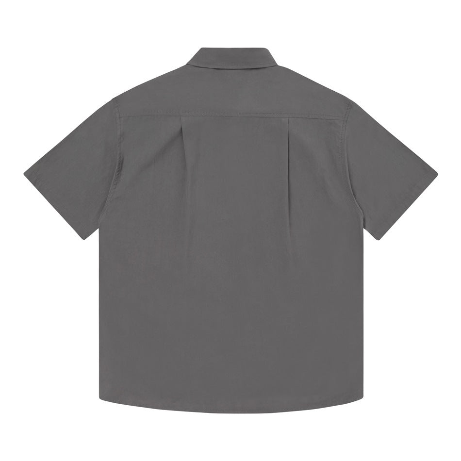 Back view of a gray short-sleeve shirt with a yoke seam and center pleat.